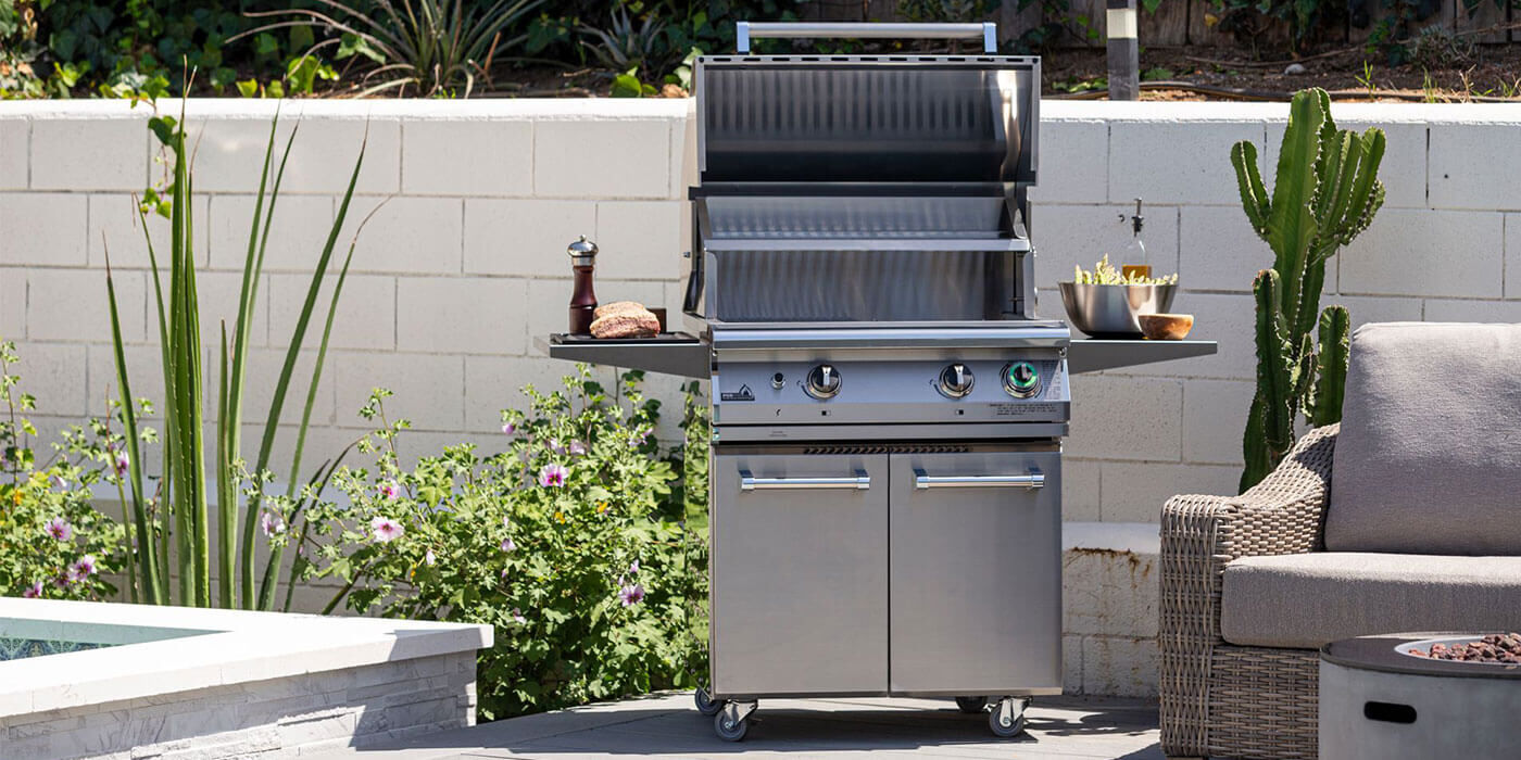 A small, stainless steel Estate Grill cart with two side shelves and two access doors that house your Propane tank.
